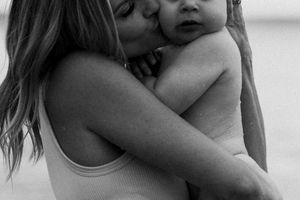 Black and white intimate portrait of maternal love and tenderness.