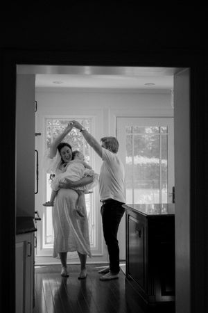 Black and white photos showing dancing silhouettes in a sunlit indoor space.