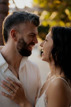Romantic couple sharing intimate moments in a series of candid sunset portraits.