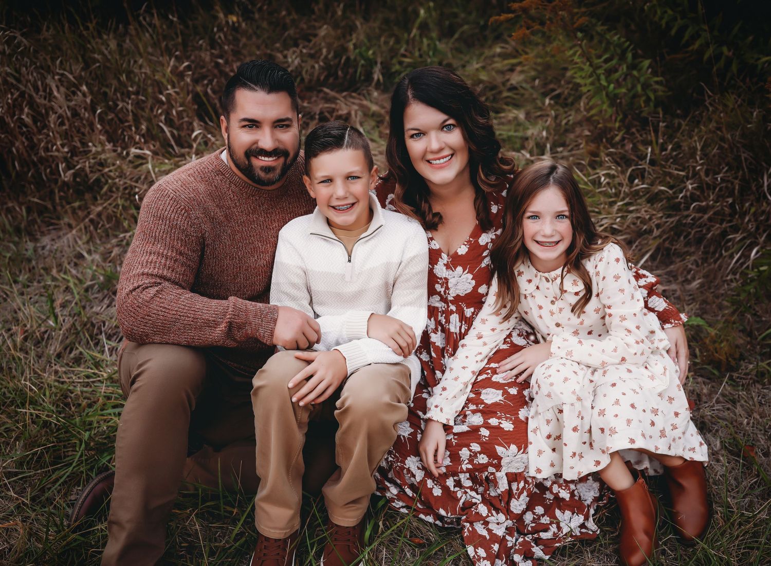 Family of 4 looking up to the camera. 

Best family photographer, Peoria, IL.