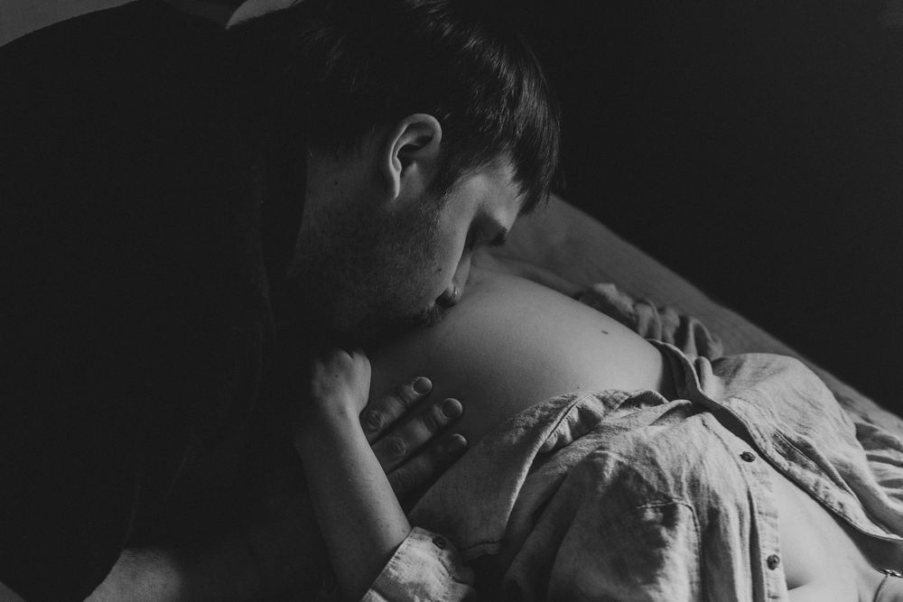 A black and white photo series showing close-up details of someone sleeping in bed.