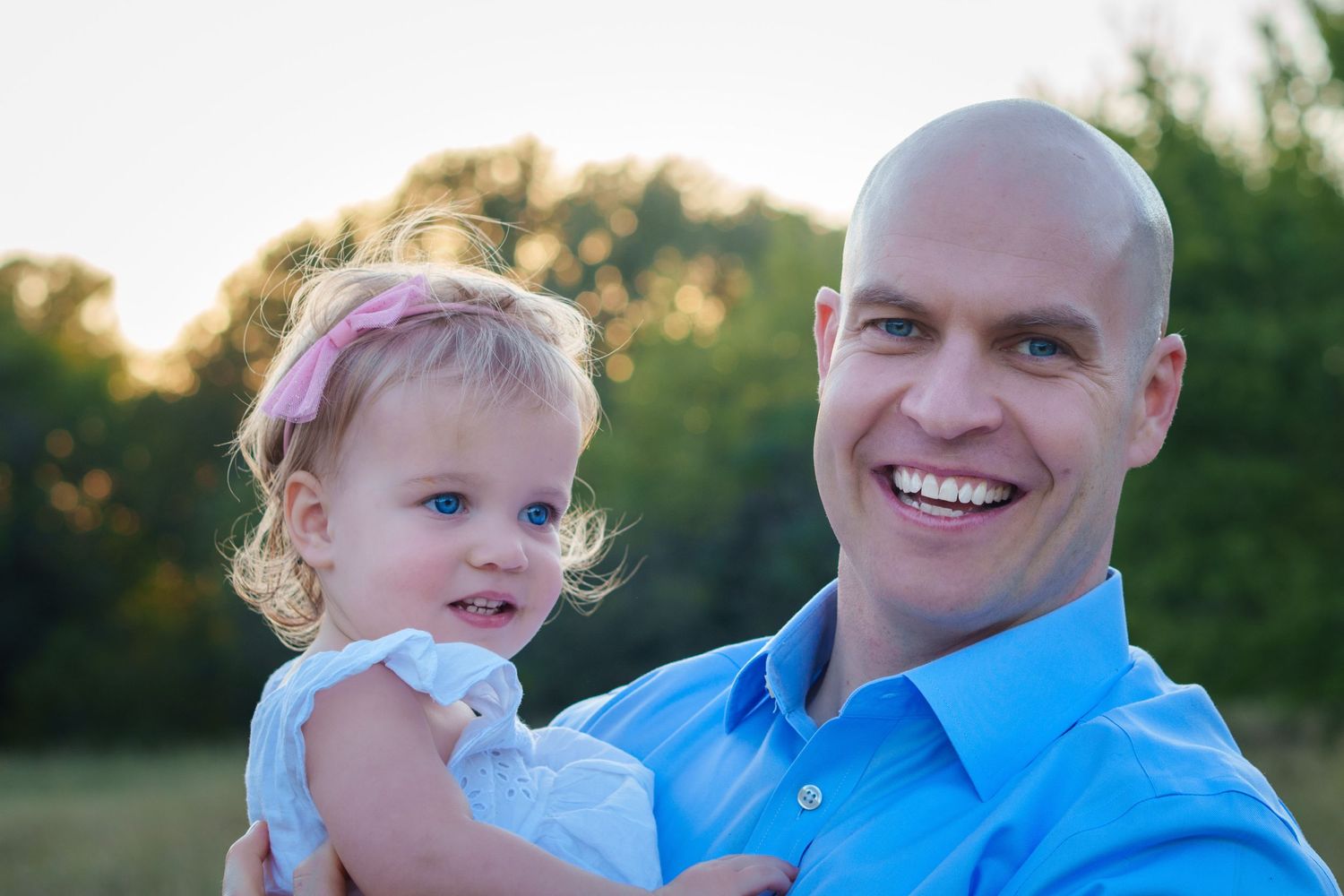 maternity photo session fall family mini baby boy expecting mom big sisters blue and blue eyes outdoors dad daughter