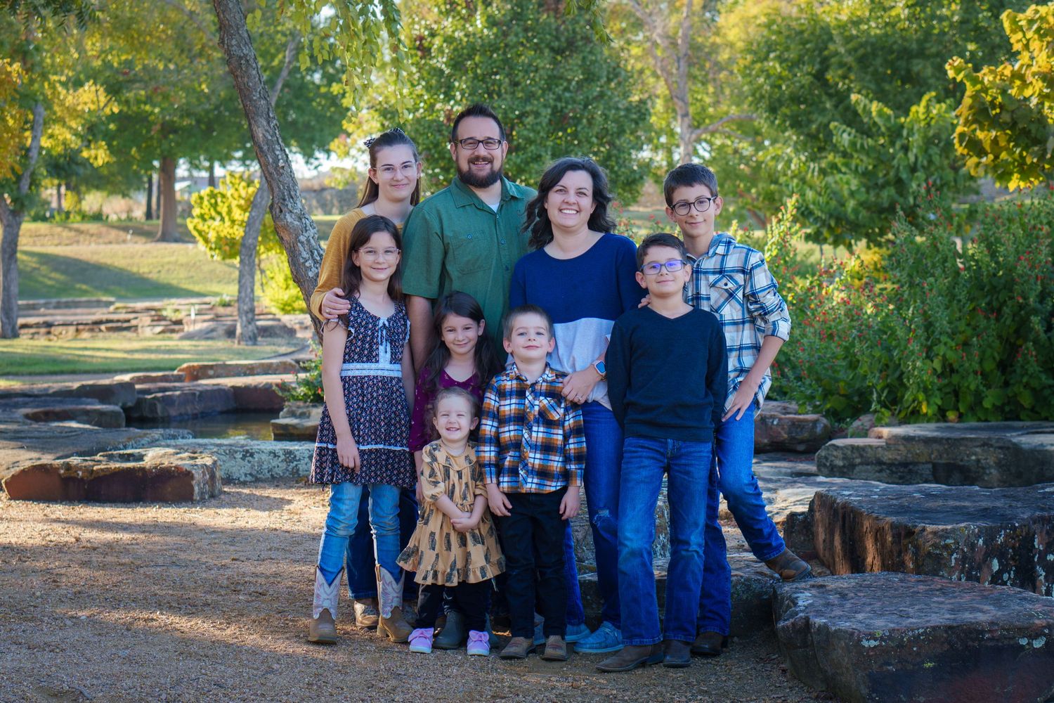 Fall family session mini urban big family extended outdoors rocks and buildings pond golden hour Westlake Texas photos