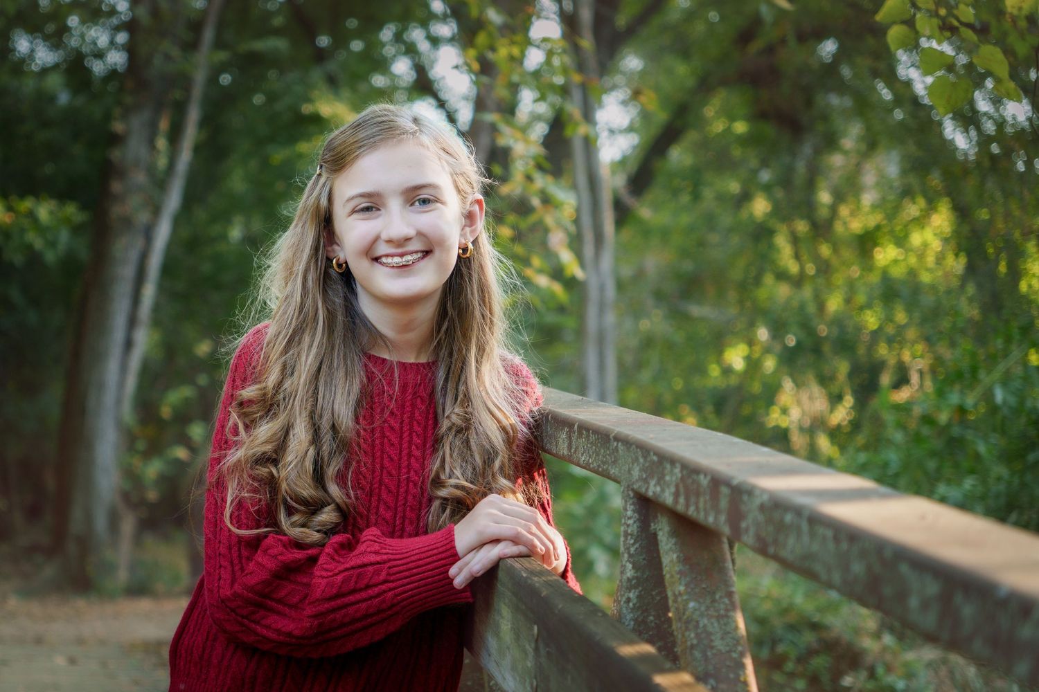 Colleyville Nature Center girl standing on bridge fall family session mini sesion fall outfit orange red  leaves boots
