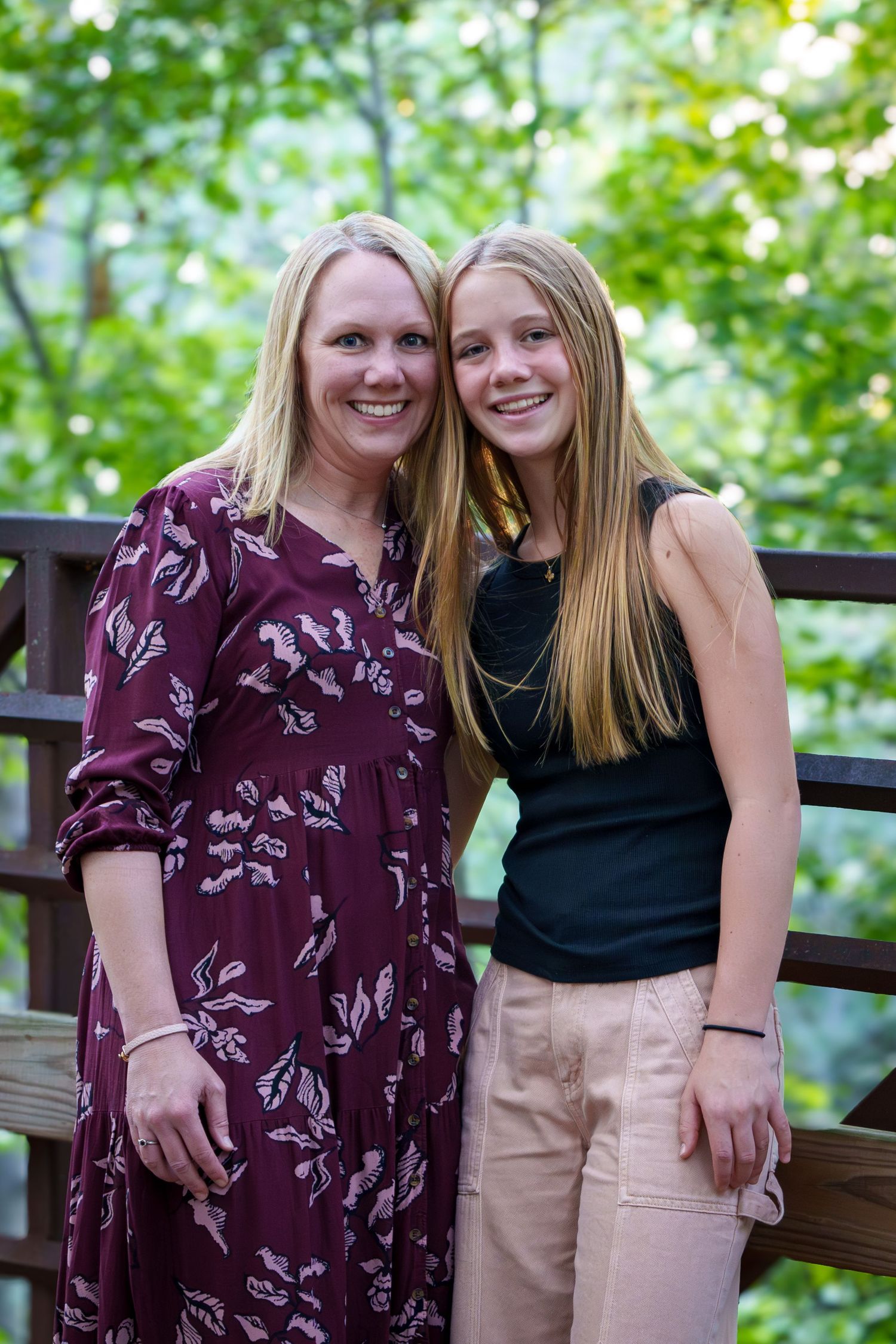 Fall family mini session Keller Texas mom daughter posing on bridge fall warm color teenage kids  Christmas cards photos