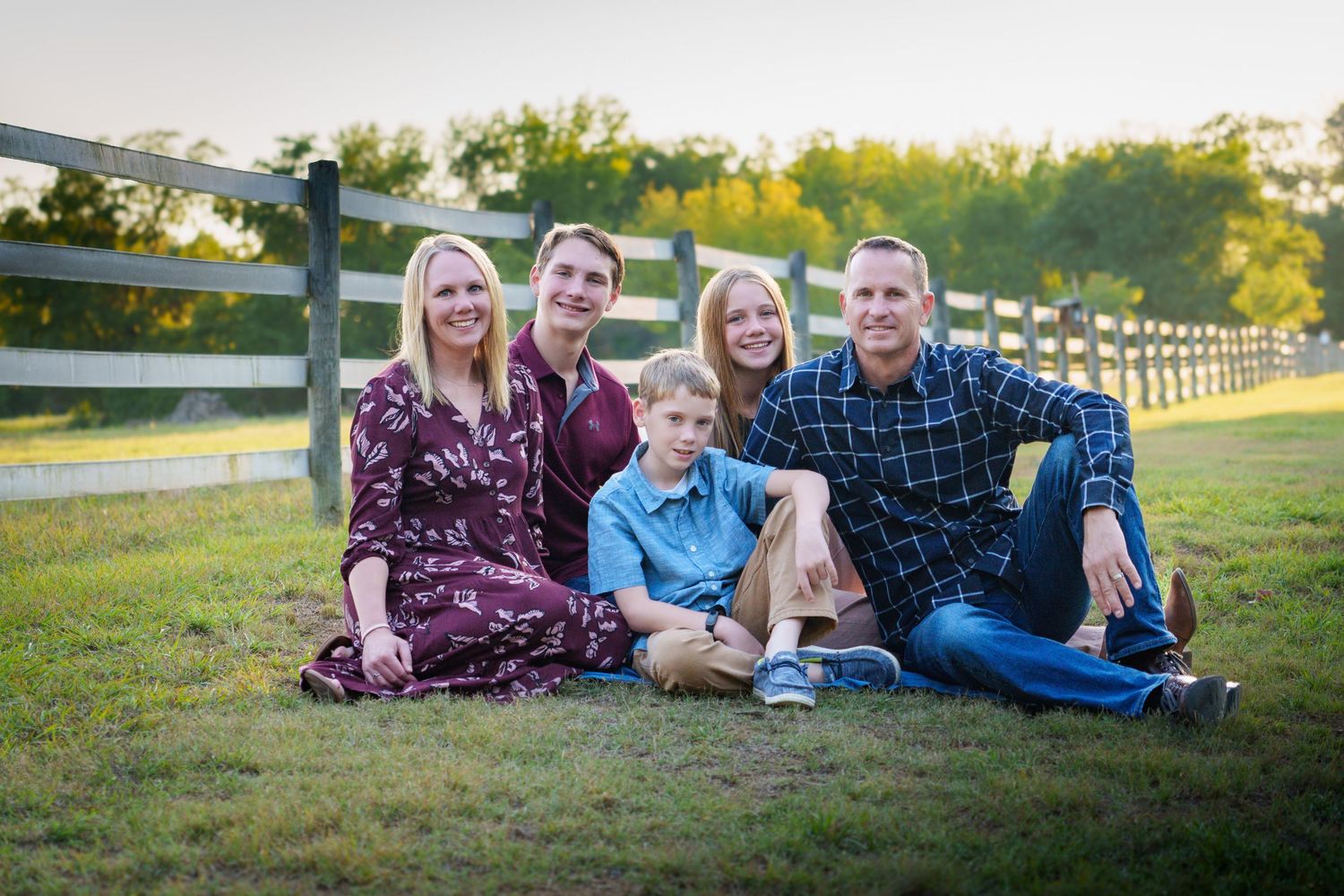 Fall family mini session Keller Texas sitting on the ground golden hour fall color teenage kids  Christmas cards photos