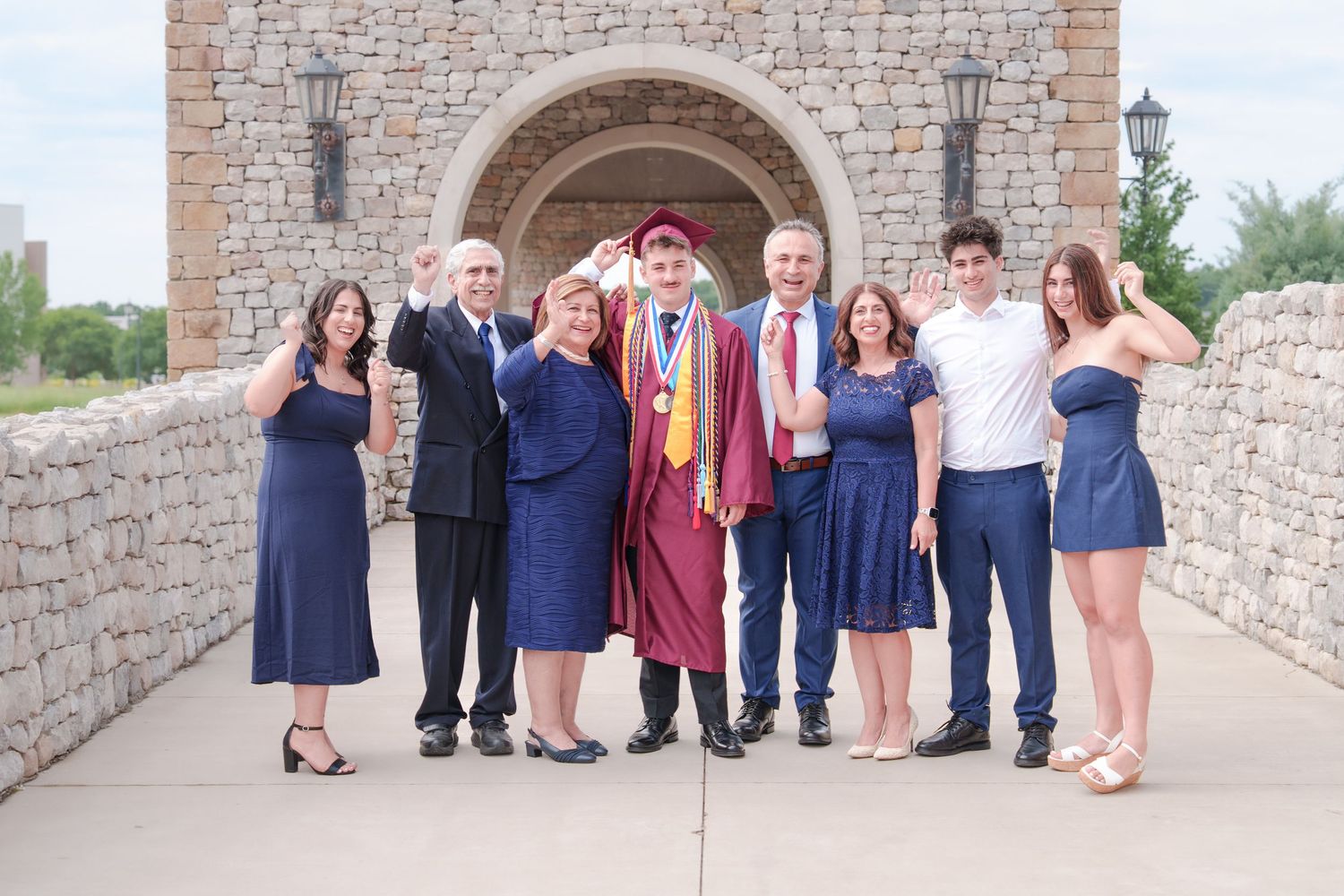 extended family photos Westlake Texas graduation day dress up cap and gown parents and grandparents celebrate milestone Westlake Acadamy