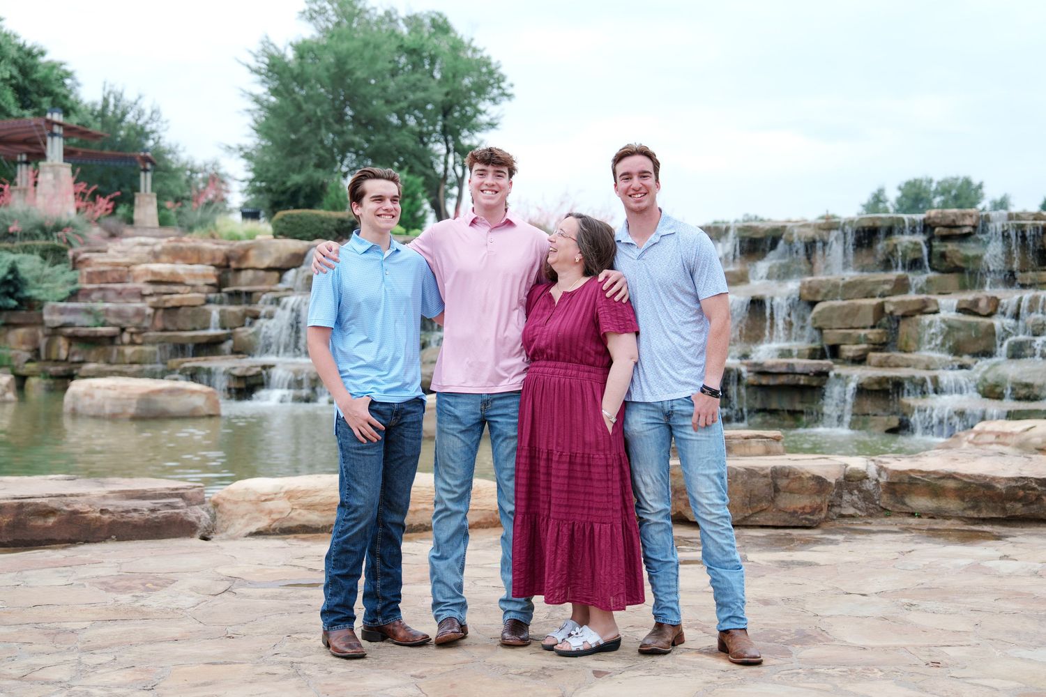 family photo session adult kids family of 5 Flower mound Texas fun moments 3 brothers waterfall outdoors