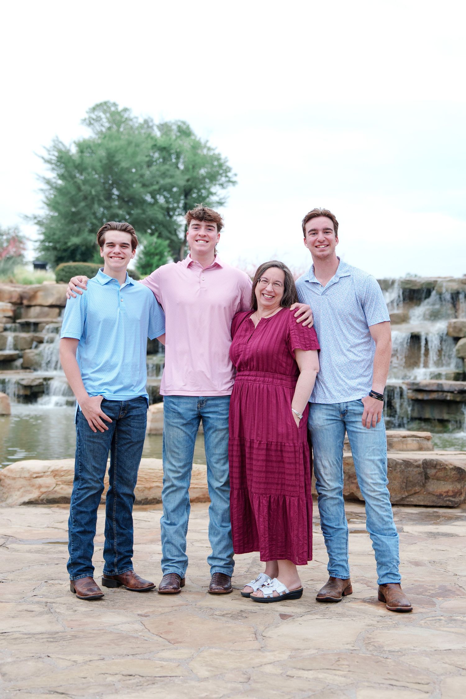 family photo session adult kids family of 5 Flower mound Texas fun moments 3 brothers waterfall outdoors