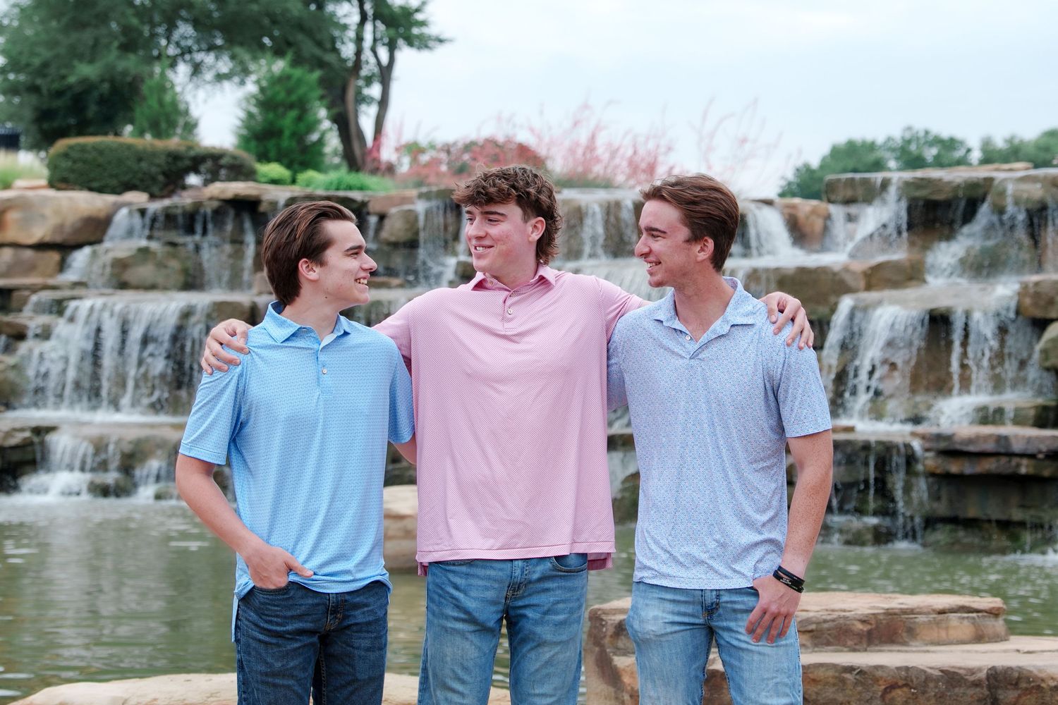 family photo session adult kids family of 5 Flower mound Texas fun moments 3 brothers waterfall outdoors