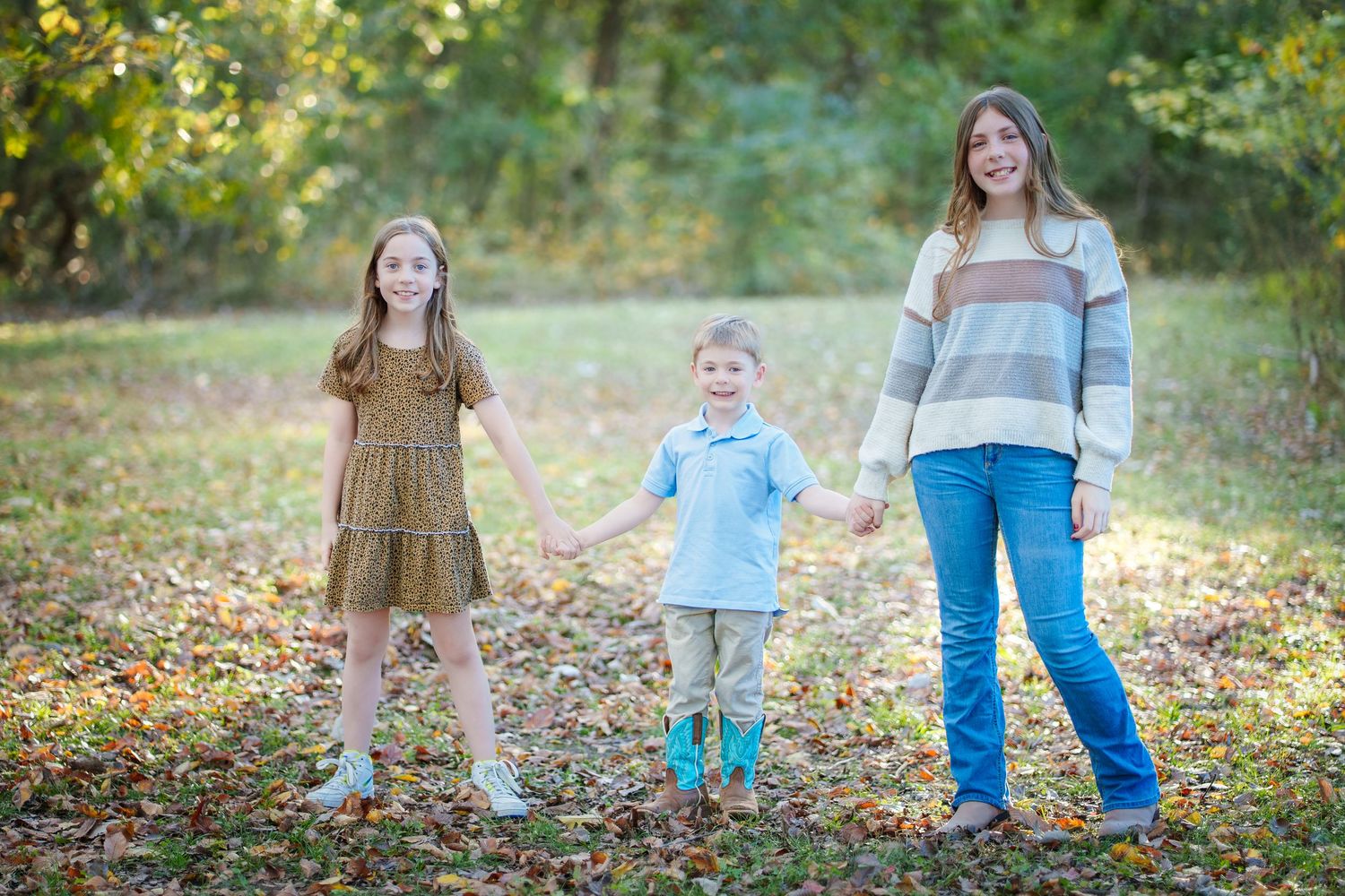 Fall family session mini Colleyville Texas mom and dad love sitting by the ponds giving backs to camera hugging parents fun telling secrets
