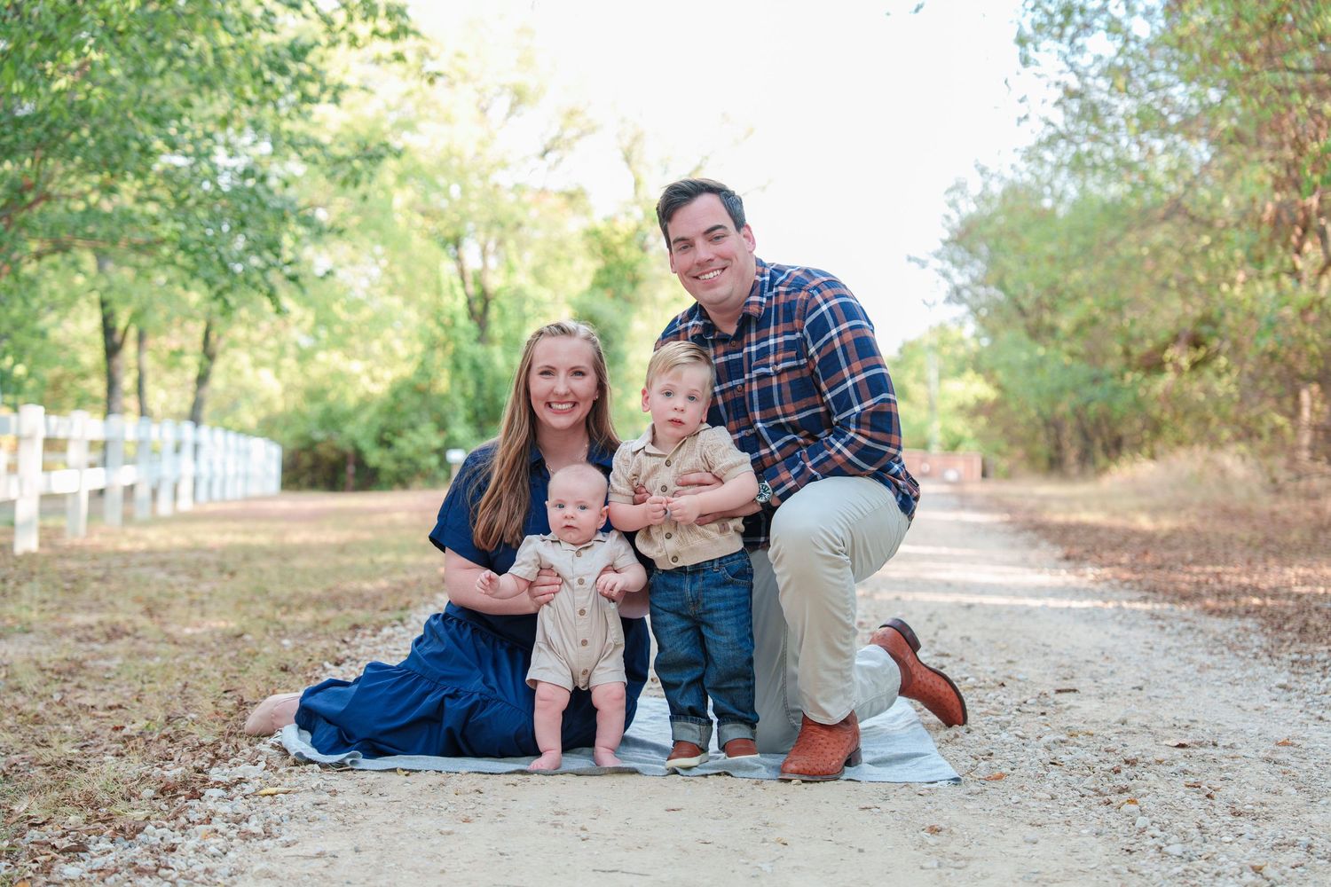 fall family photos Trophy Club Park Texas found kids posing fall leaves matching outfits Christmas cards outdoors family of 4 baby big bro