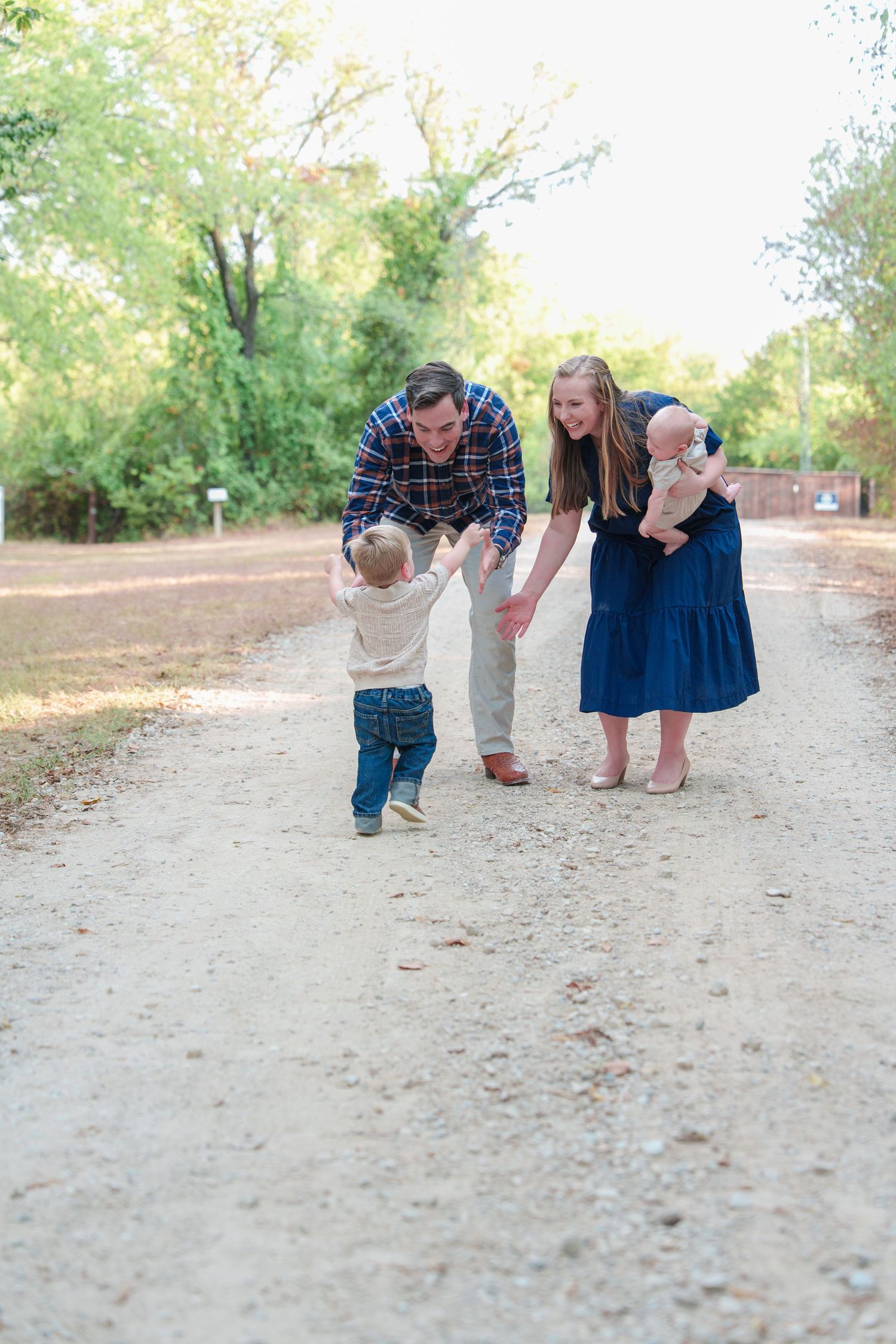 fall family photos Trophy Club Park Texas found kids posing fall leaves matching outfits Christmas cards outdoors family of 4 baby big bro