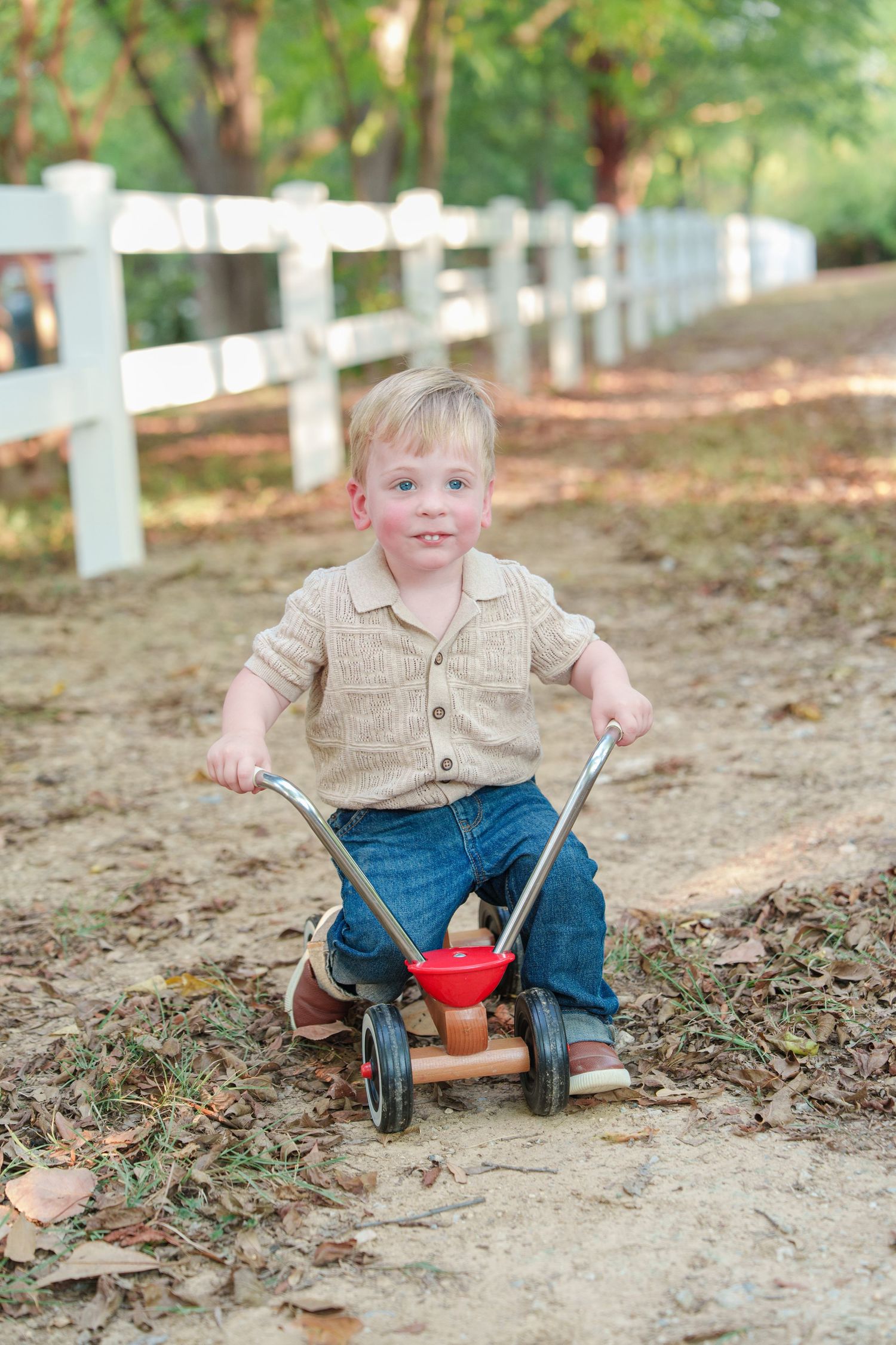 fall family photos Trophy Club Park Texas found kids posing fall leaves matching outfits Christmas cards outdoors family of 4 baby big bro