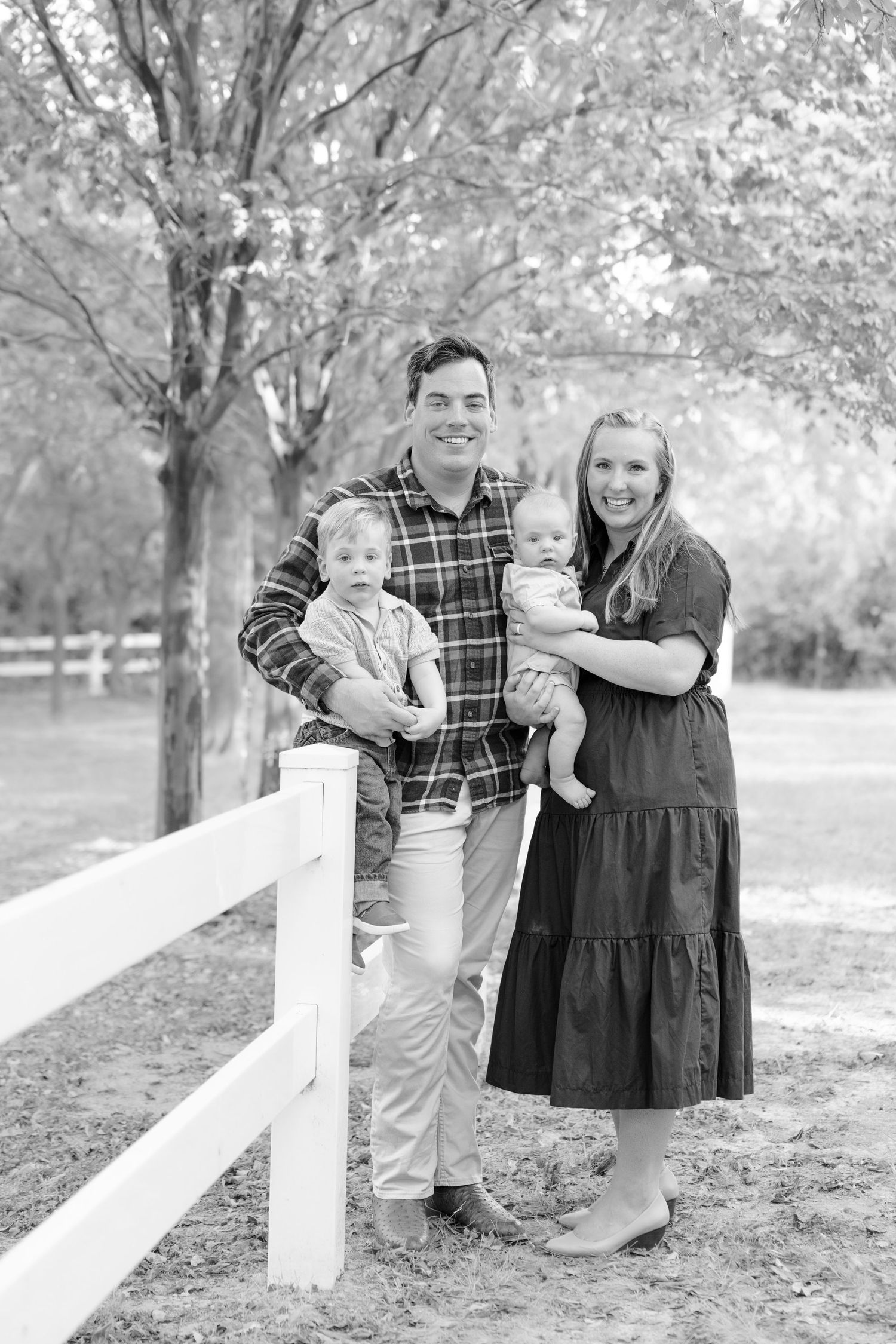 fall family photos Trophy Club Park Texas found kids posing fall leaves matching outfits Christmas cards outdoors family of 4 baby big bro