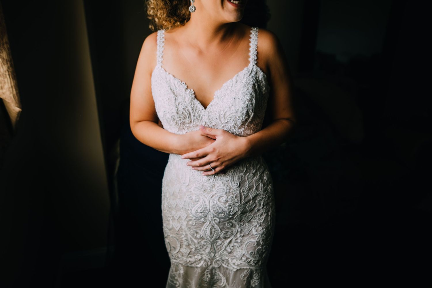 Maddie's applique lace dress is showcased in this dress as the light intimately falls on just her dress. She smiles