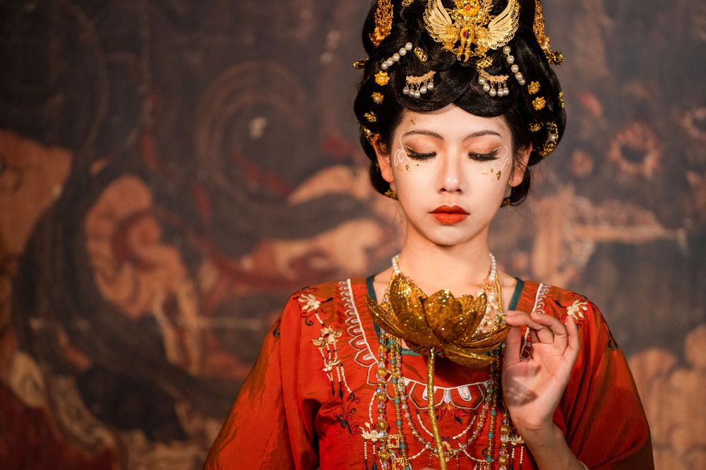 Divine studio photography of Dunhuang Apsaras Hanfu styling with cinematic lighting and mural backdrop, by Imagine Image Studio.