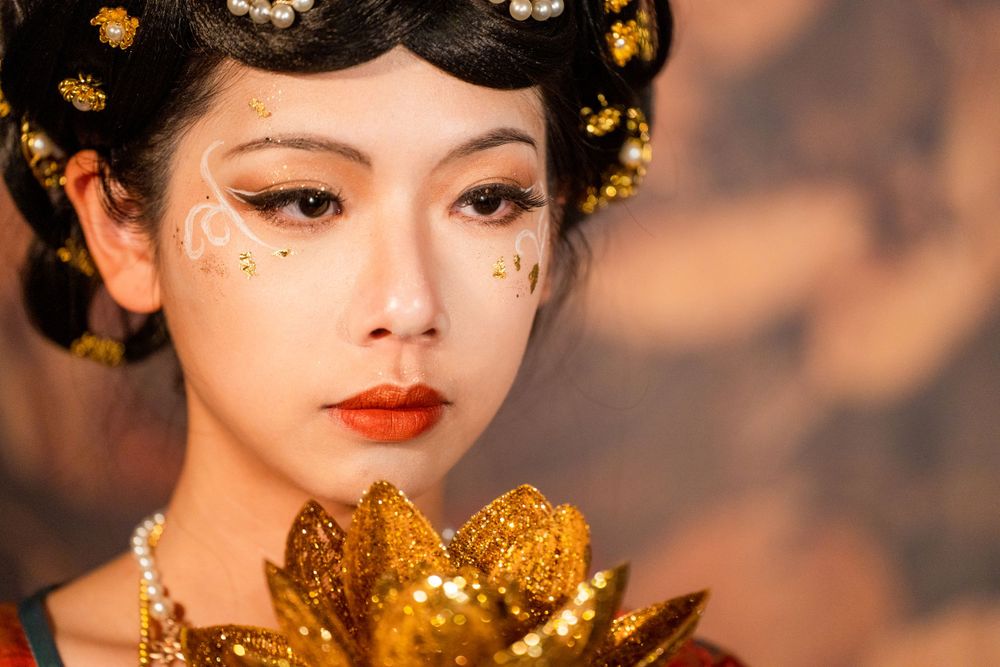Sacred Tang Dynasty Hanfu portrait featuring Dunhuang styling and a cave mural background, by Imagine Image Studio Auckland.