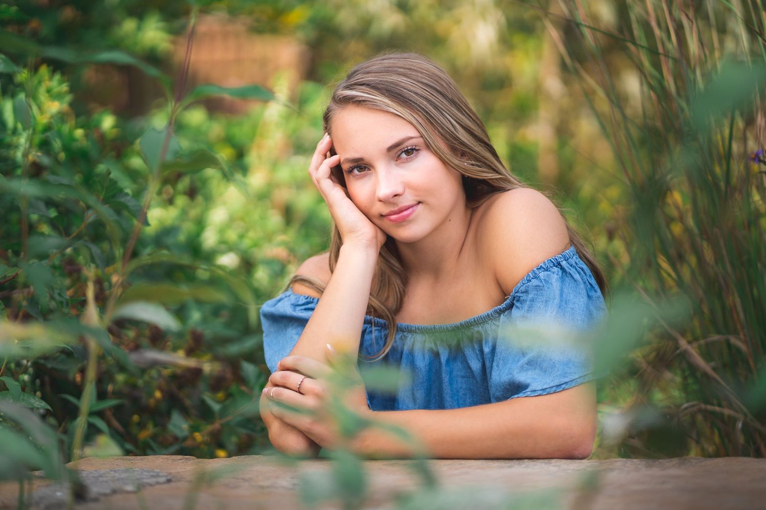 Outdoor portraits with natural bokeh effect against a green garden background.