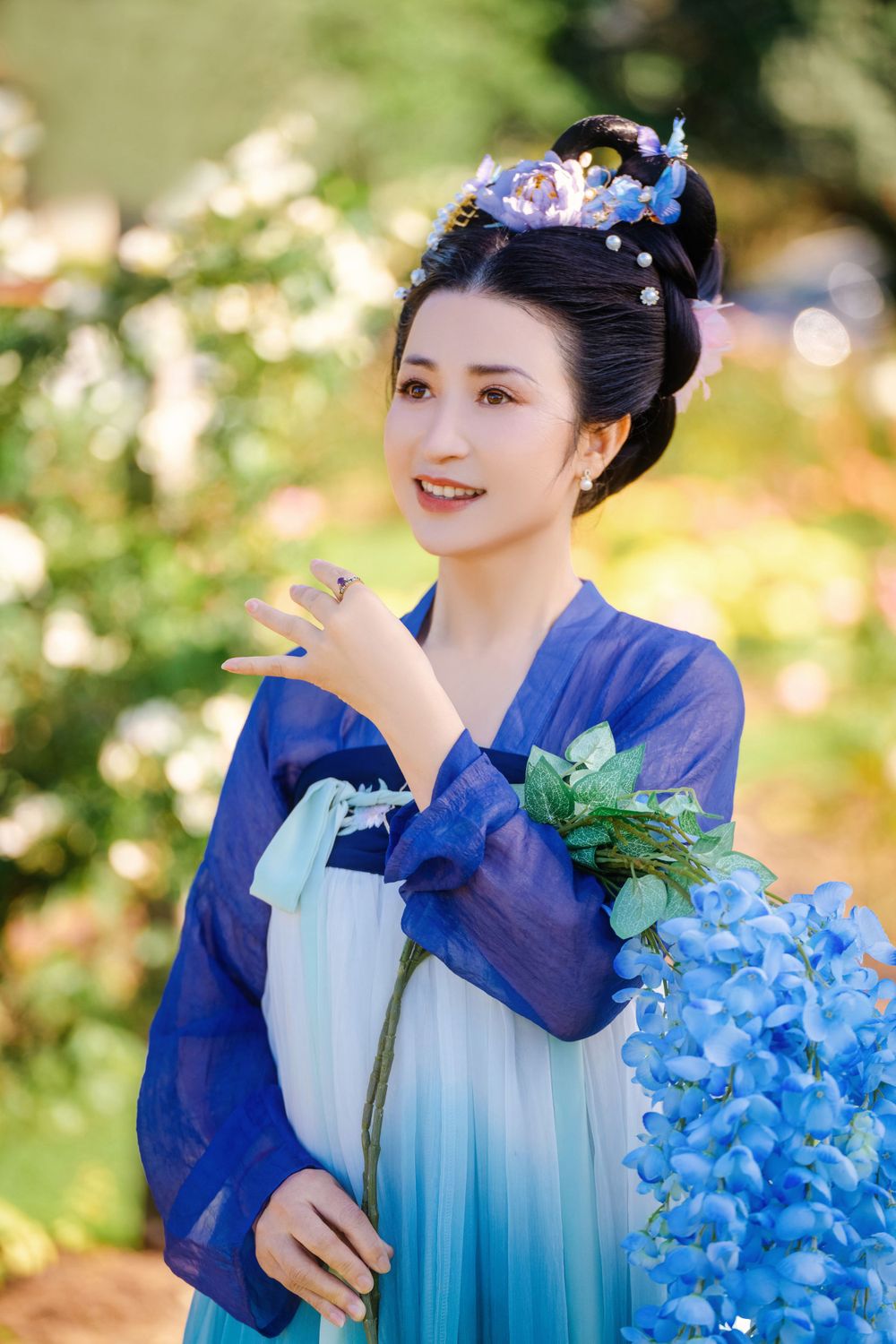 Dynamic natural sunlight portrait of a couple hugging and dancing in Tang Dynasty Hanfu among blooming roses, by Imagine Image Studio.