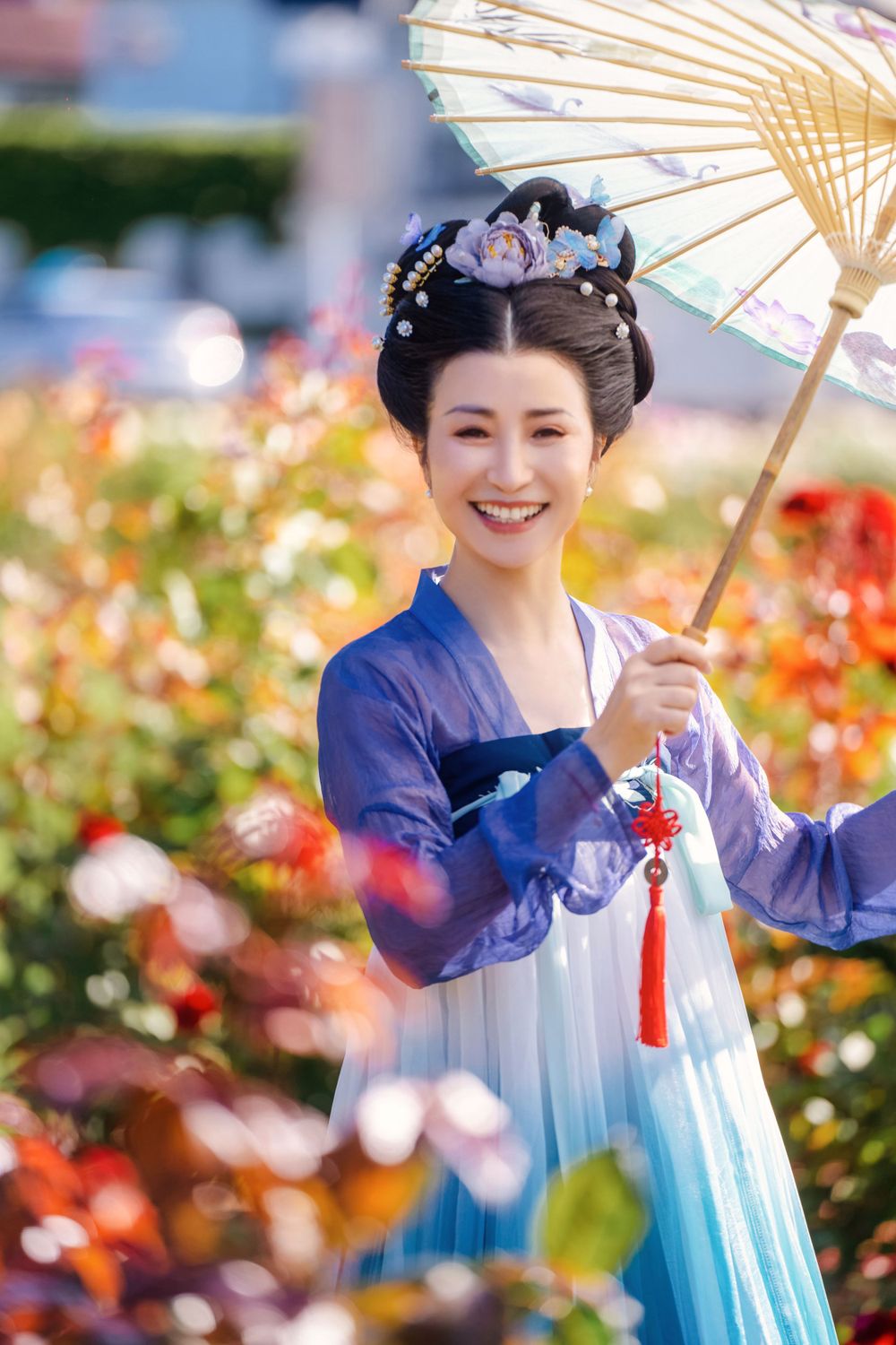 Dynamic natural sunlight portrait of a couple hugging and dancing in Tang Dynasty Hanfu among blooming roses, by Imagine Image Studio.