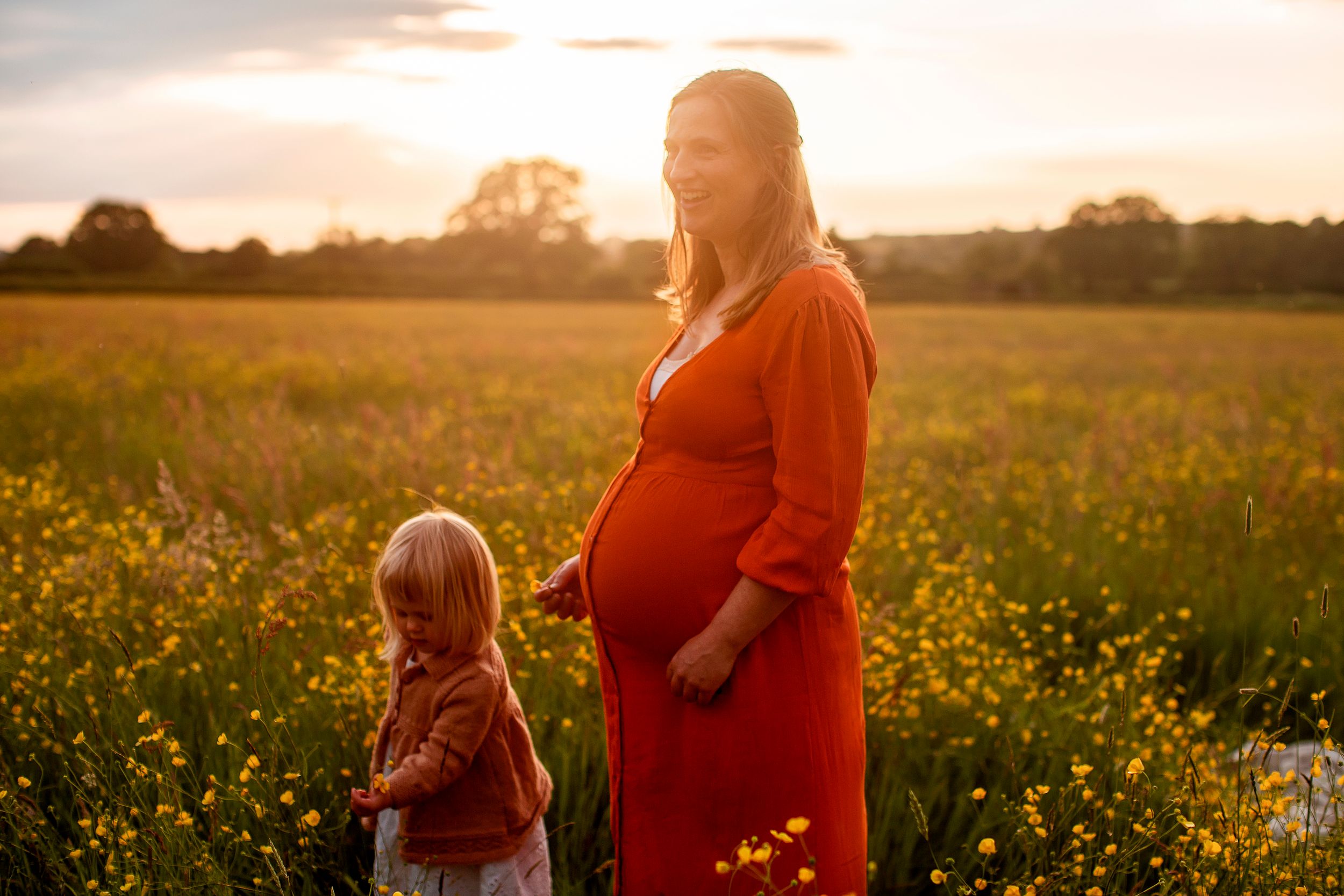 Summer photoshoot of mother and daughter in golden light