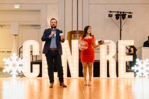 Keynote speaker addressing audience at Houston Company holiday event by Cypress business photographer