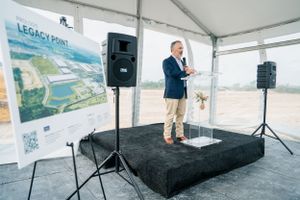Keynote speaker addressing audience at Cypress grounbreaking business event by Cypress business photographer