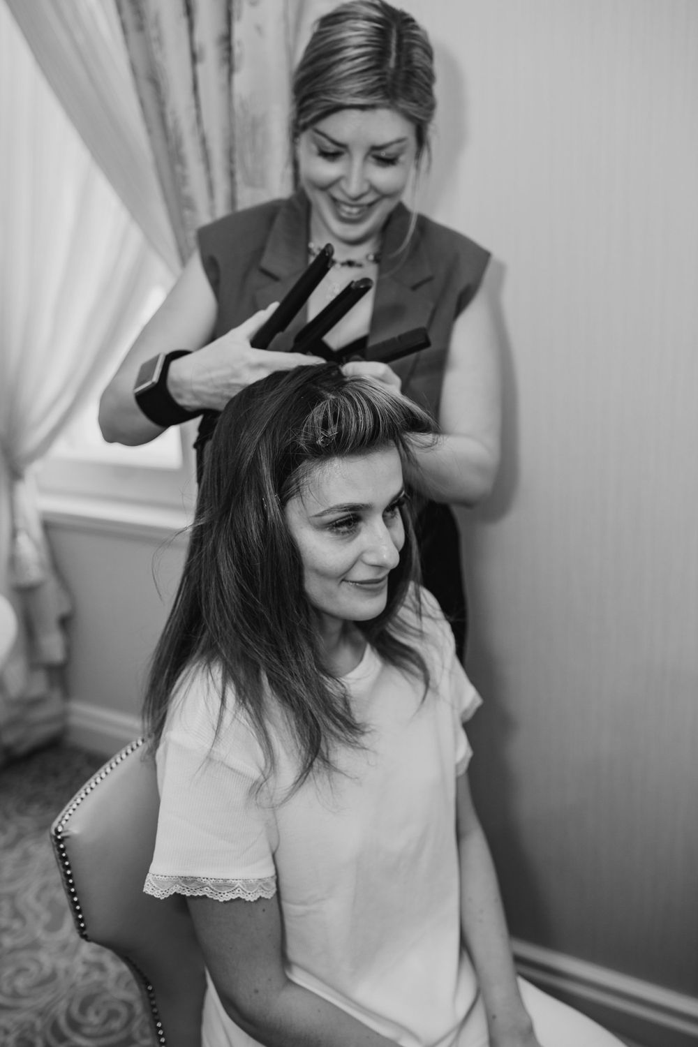 Hair styling session in progress with professional tools.