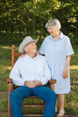 A cowboy and his wife pose for their spring 2026 family photos on their granddaughter's ranch in Council Hill, Oklahoma.