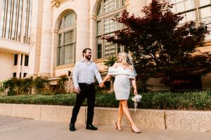 A couple take a stroll during their engagement session in Oklahoma City, Oklahoma.