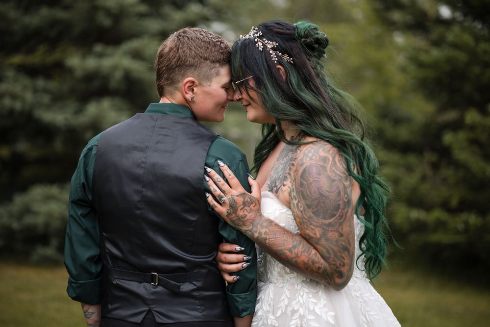 Romantic wedding couple shares kiss outdoors surrounded by lush greenery in multi-frame photo sequence.
