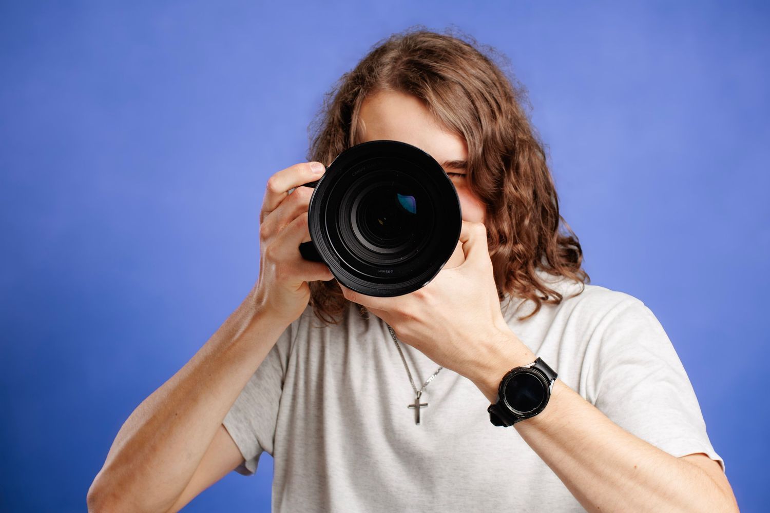Adam Hetland holding camera