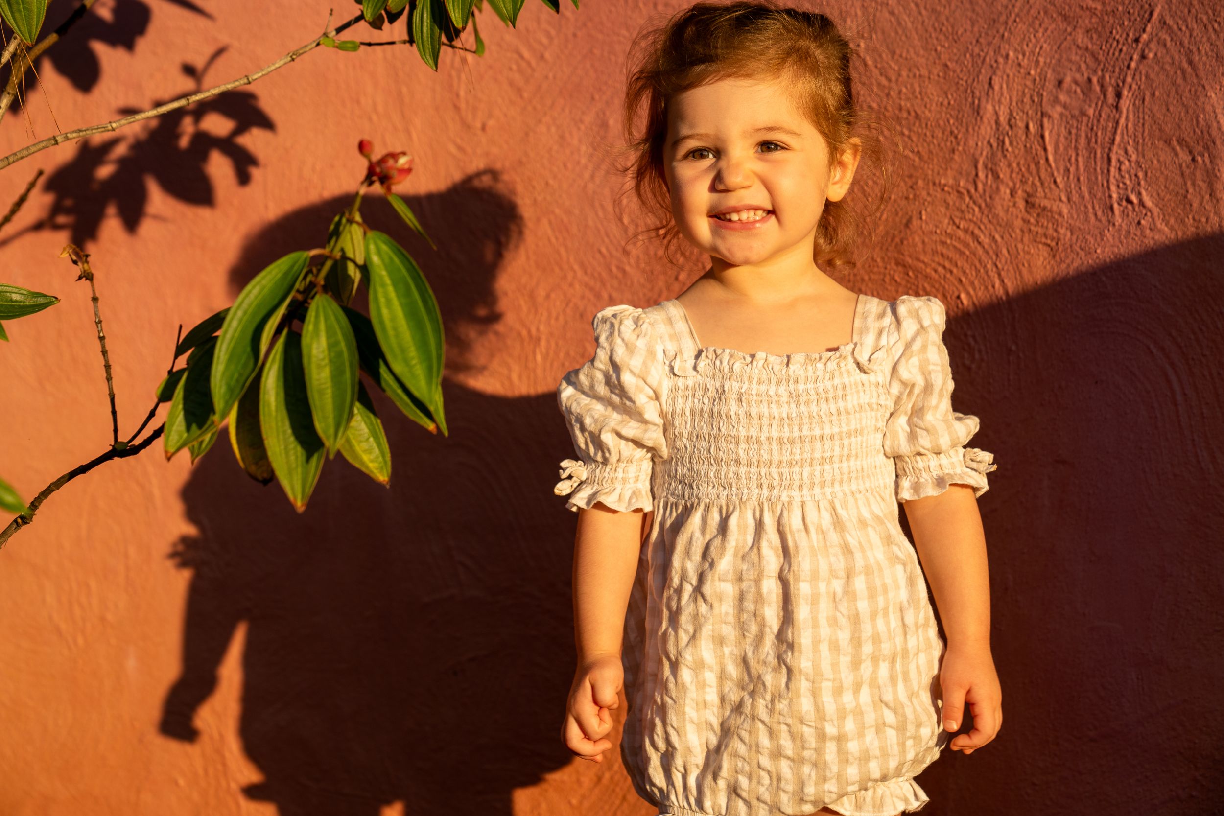 A cute toddler posing for a family photo shoot at Fagan Park, Galston, Sydney.