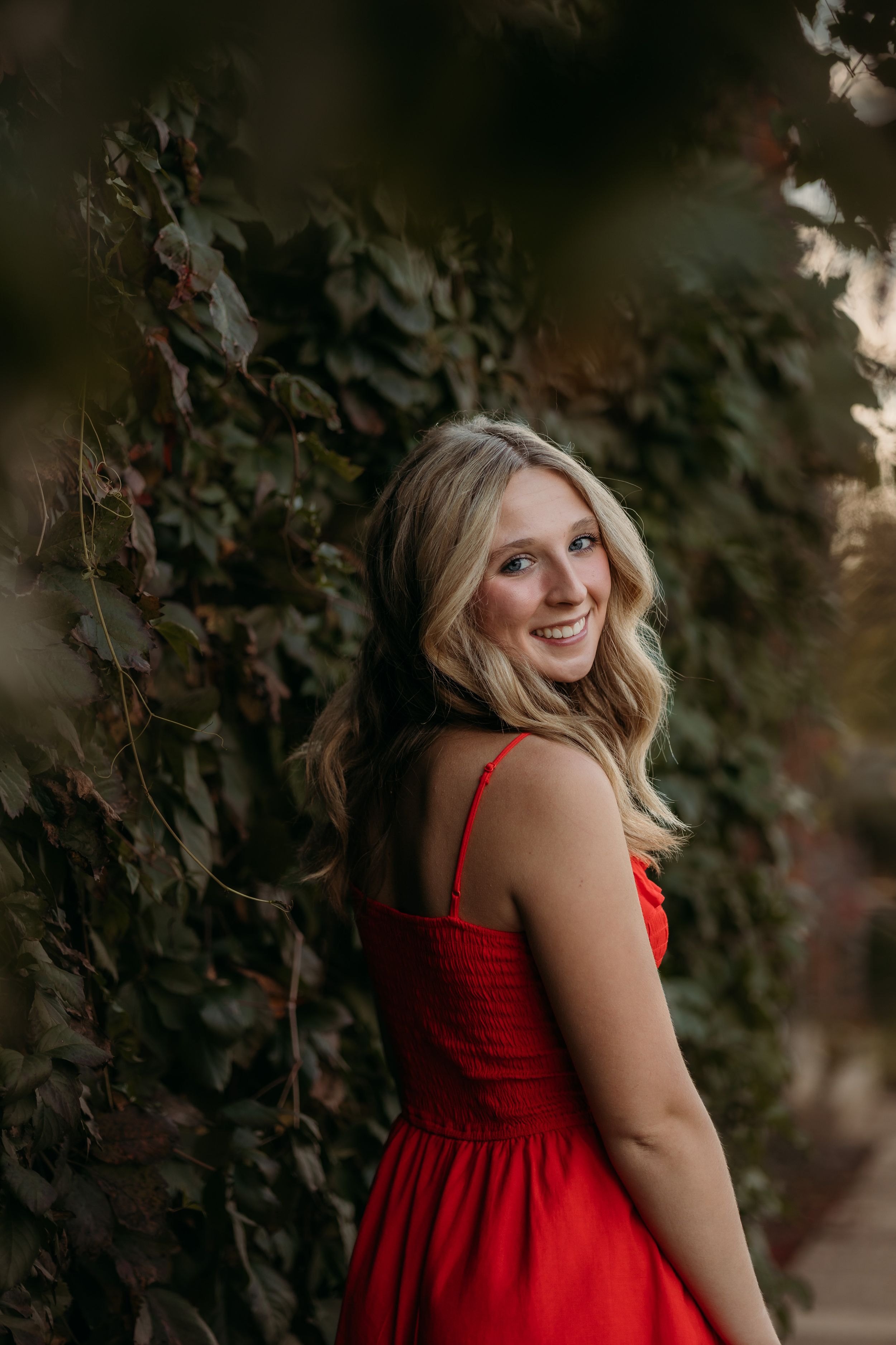 MN high school senior portrait against foliage