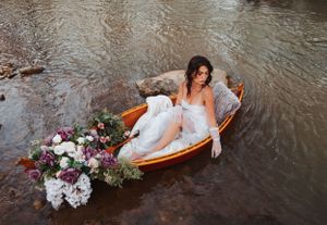 Bridal photography session in a canoe, beautiful creek location