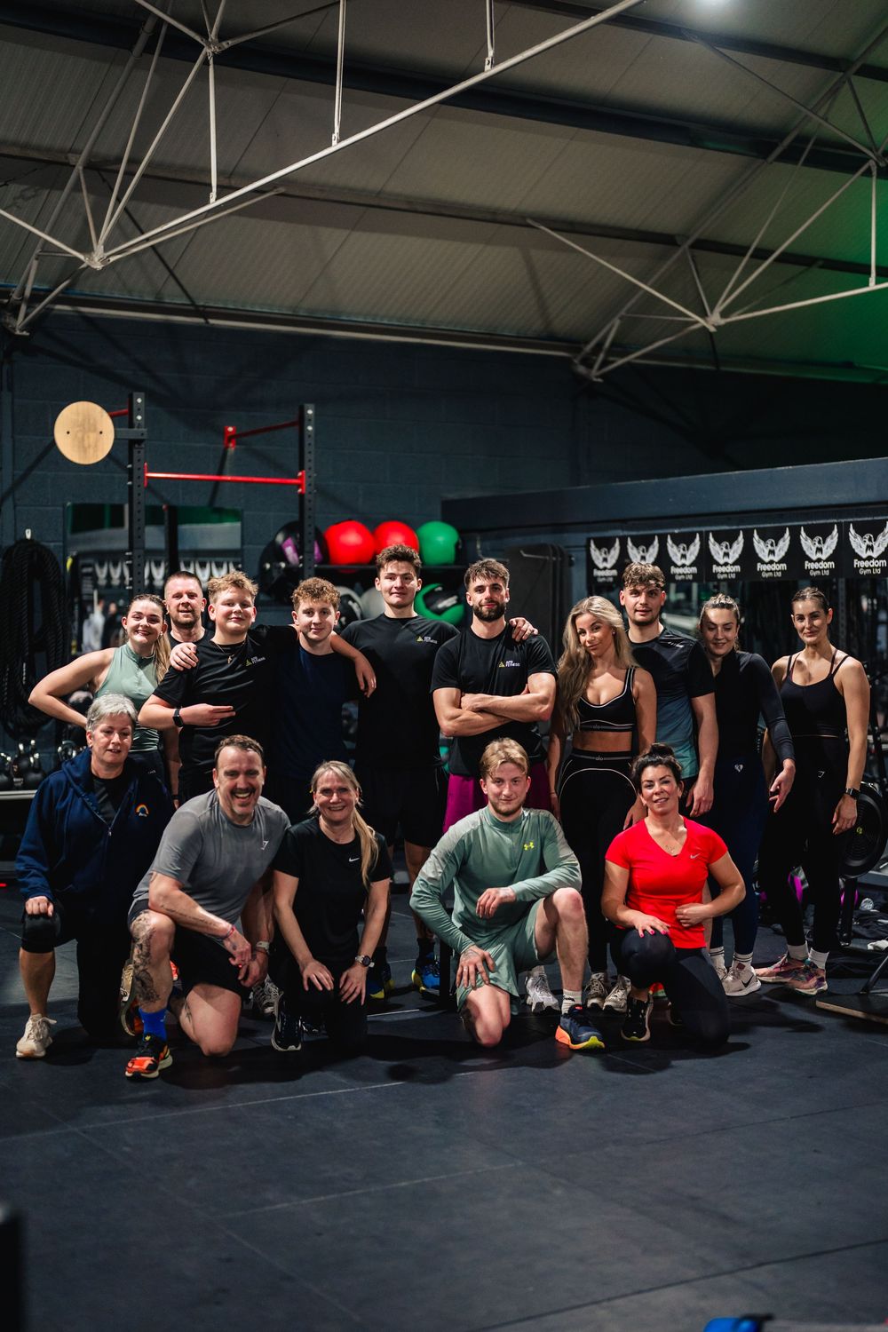 Group of trainers and members posing inside Freedom Gym in Tortworth.