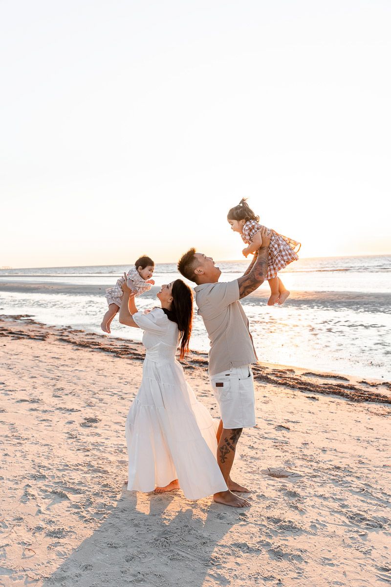 Family photographer Adelaide — parents and children laughing together outdoors, natural light lifestyle session — Photo By Nancy