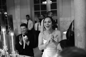 Black and white candid reception moments showing laughter and joy.