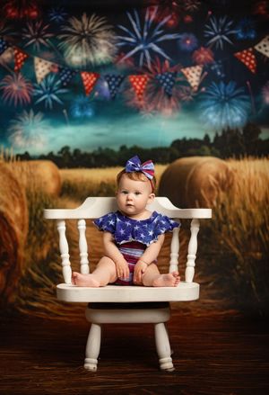 A patriotic Fourth of July themed photo series in a rustic setting with fireworks overlay and festive props.