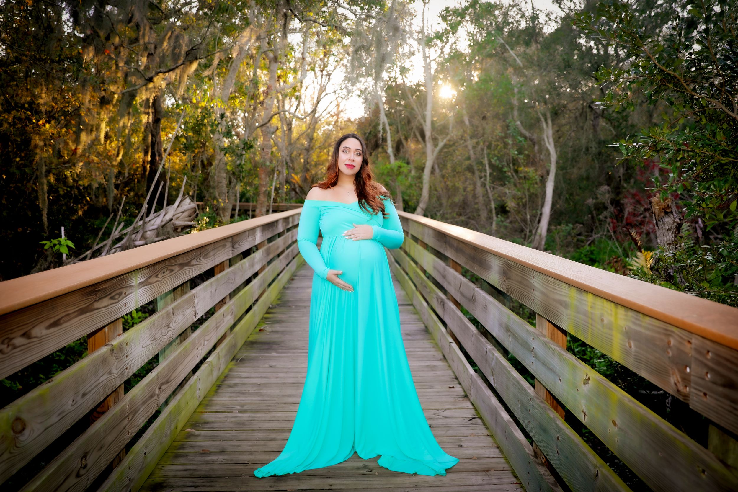 Sunlit Maternity Photo on Nature Bridge | Emotional Family Photography in Natural Light