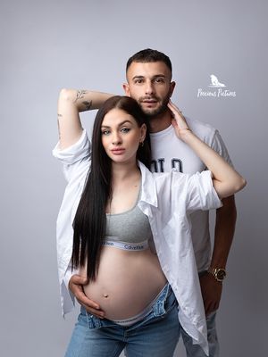 Artistic studio maternity session with a couple in white shirts and denim, captured by Precious Pictures photography, Rabat, Malta
