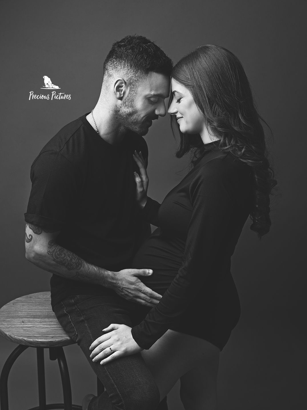 Fine art maternity photography Malta, close-up black & white portrait of a couple celebrating pregnancy at Precious Pictures studio
