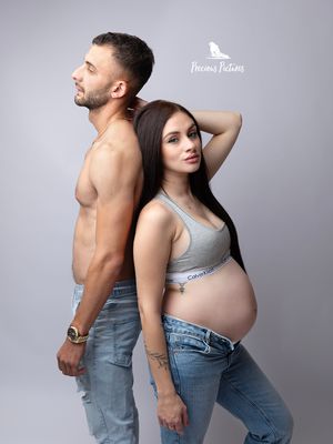 Stylish couple maternity portrait in denim and sportswear, professional studio pregnancy photography by Precious Pictures, Malta