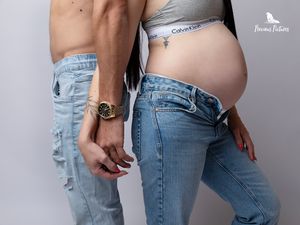 Modern studio maternity photoshoot in denim jeans with a focus on the baby bump by Precious Pictures, Malta.