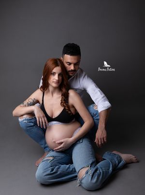 High-fashion studio maternity portrait of a couple in denim by Precious Pictures photography, Malta.