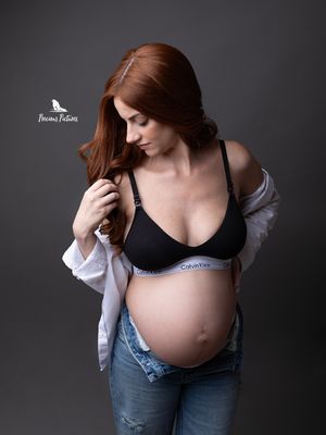 Studio lifestyle maternity portrait in jeans and white shirt by Precious Pictures photography, Malta.
