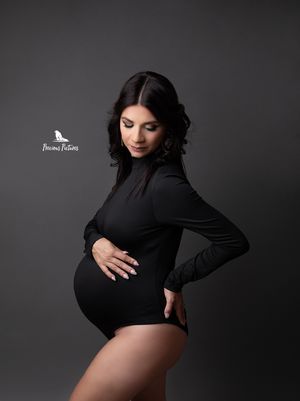 Elegant studio maternity profile in a black bodysuit, professional pregnancy photographer Rebecca at Precious Pictures, Malta