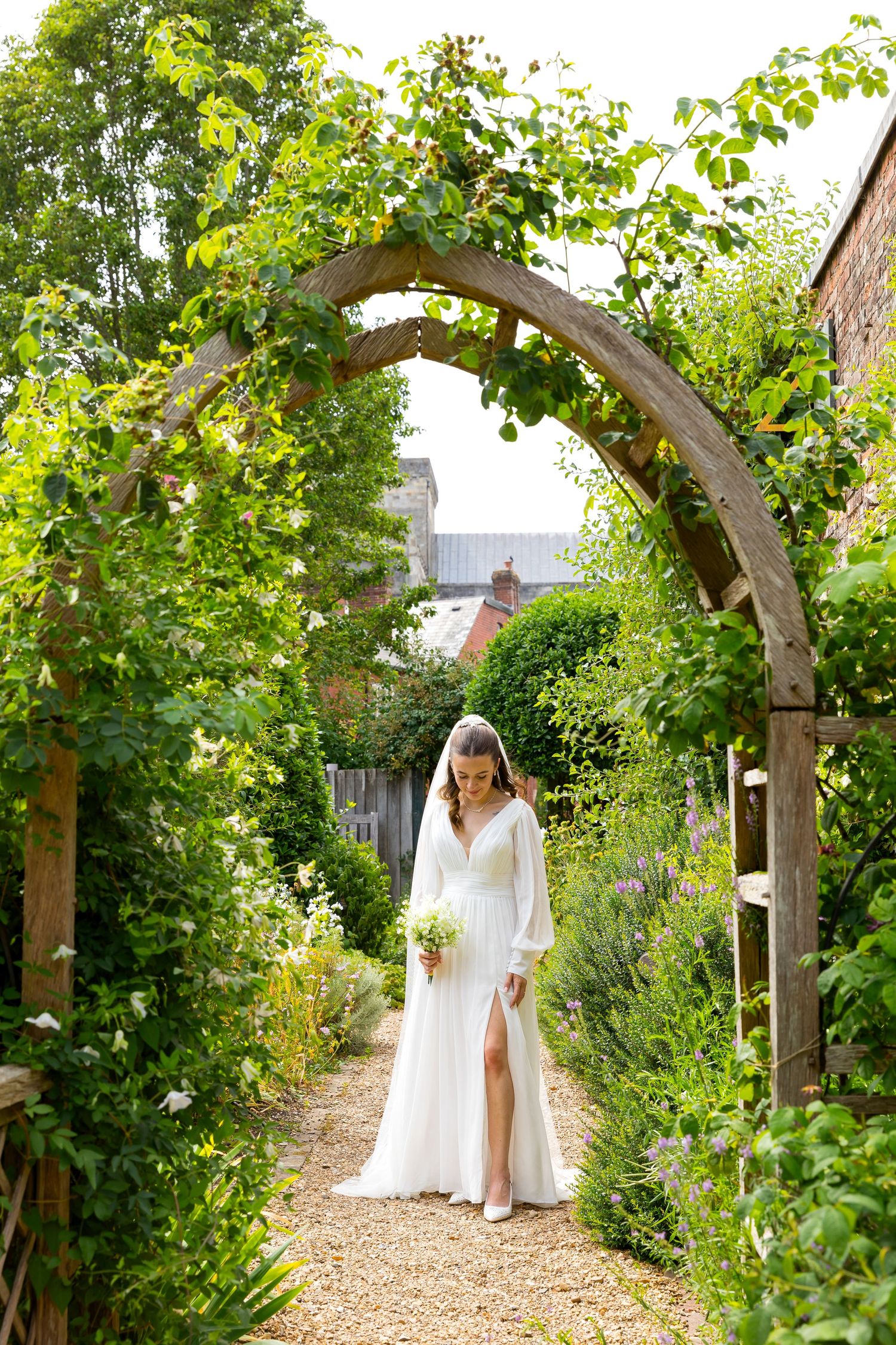 Photo of bride in nearby gardens at White Horse Hotel, Romsey.
