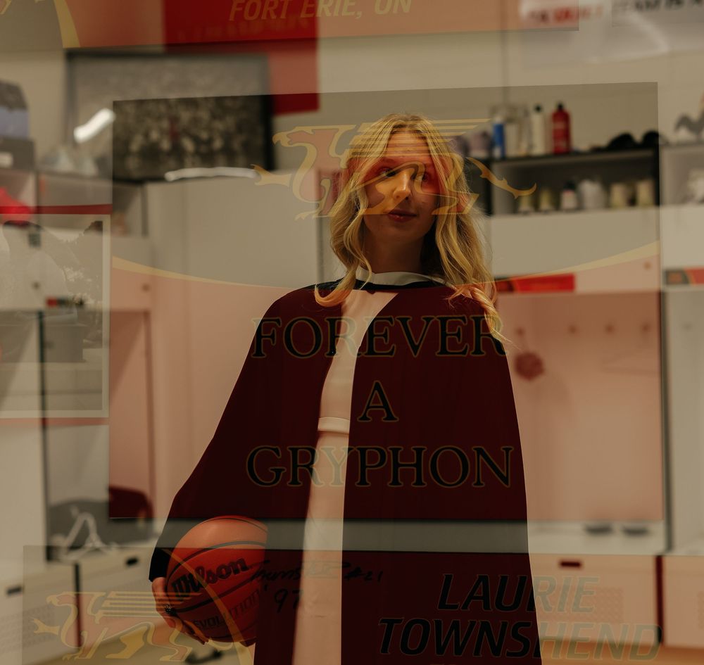A collection of clothing items displayed on hangers in a retail store with red accents and glass partitions.